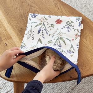 1. Put the cooled bread into the bag Please let bread cool to room temperature before putting it in the bag. Beeswax softens at 113°F and can be damaged by warm bread.